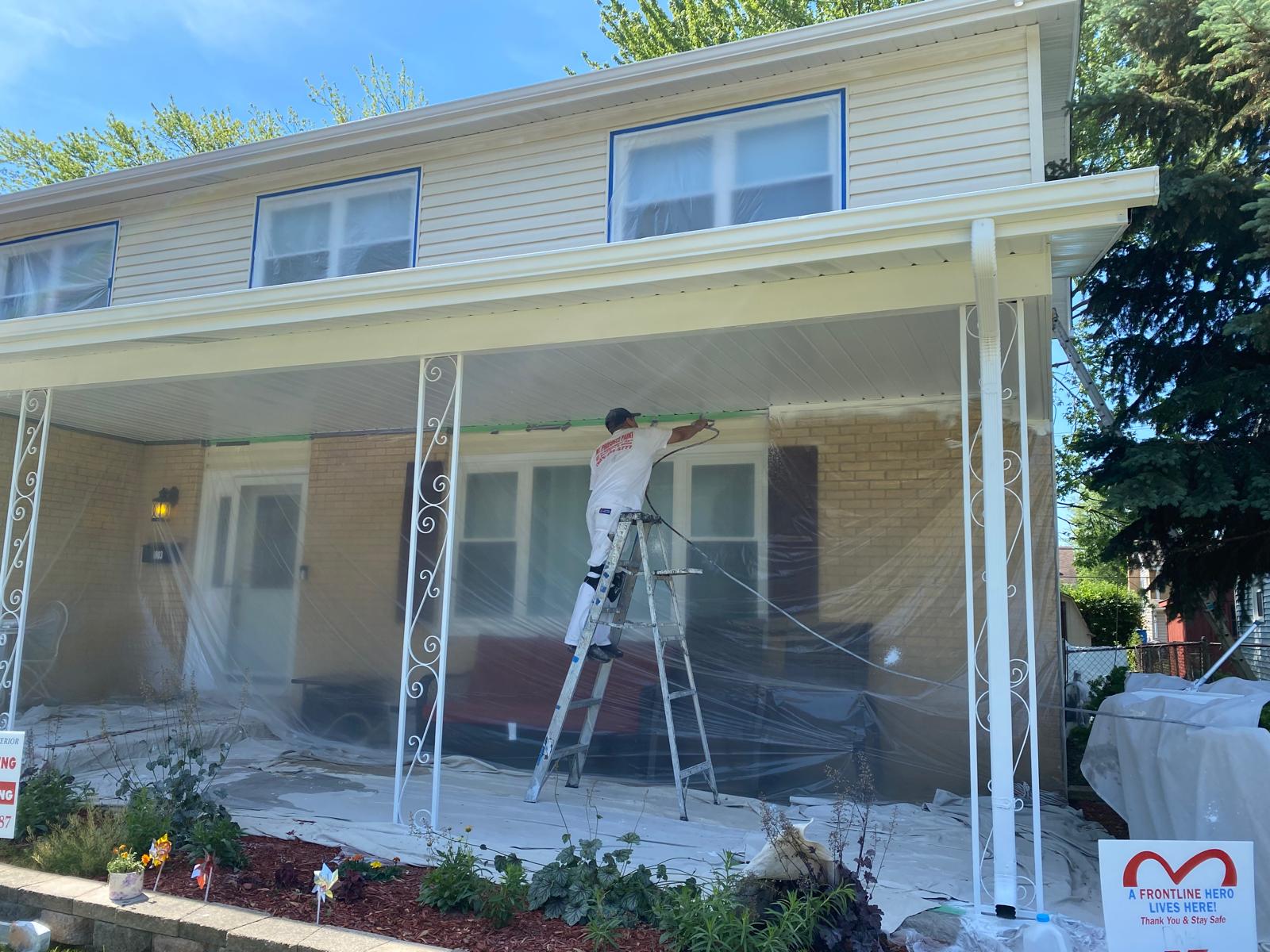 TPT Decorating crew painting a house exterior