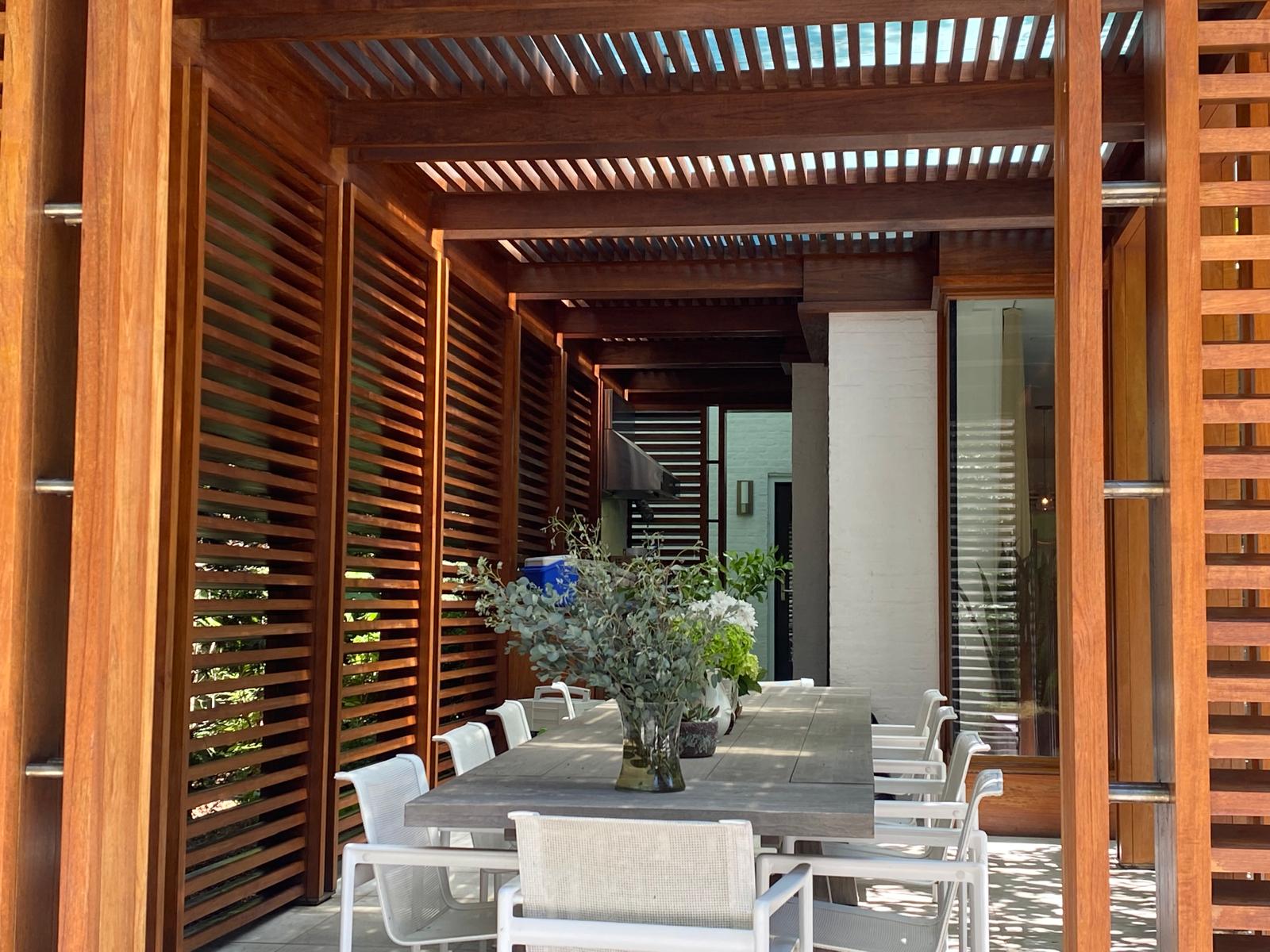 Beautifully stained wood pergola outdoor structure